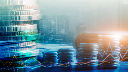 Financial investment concept, Double exposure of stack of coins and city for finance investor, Forex trading market candlestick chart, Cryptocurrency Digital economy. investing growing.economy trendsの写真素材