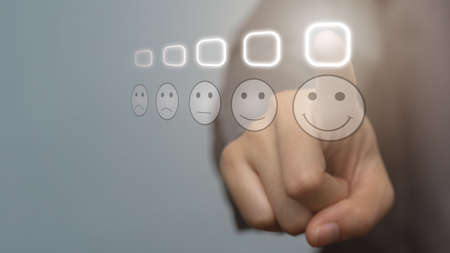 Customer Experience Concept, Businessman pressing smiley face emoticon on virtual touch screen. new...