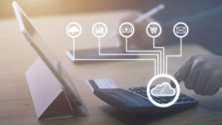 Businessman using tablet and smartphone sales data and economic growth, Financial investment, Digital link tech, big data, Cloud technology. Data storage. Networking and internet service - (IOT)の写真素材