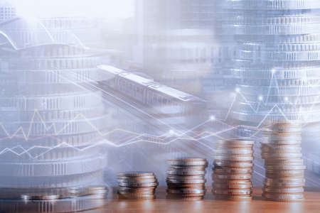 Financial investment concept, Double exposure of stack of coins and city for finance investor, Forex trading market candlestick chart, Cryptocurrency Digital economy. investing growing.economy trendsの写真素材