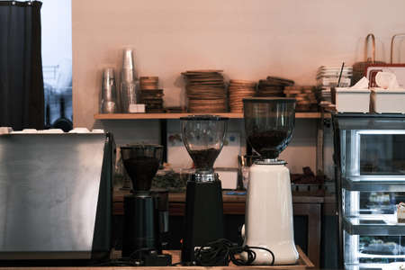 Barista preparing coffee using coffee maker and drip kettle. Man making coffee. Alternative ways of brewing coffee. Coffee shop, good quality coffee beans.の写真素材