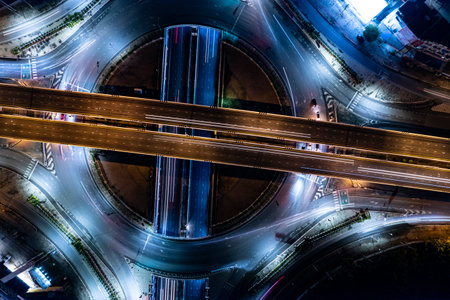 Car, taxi, and bus traffic on road intersection at night, traffic transportation, Asia city life,...