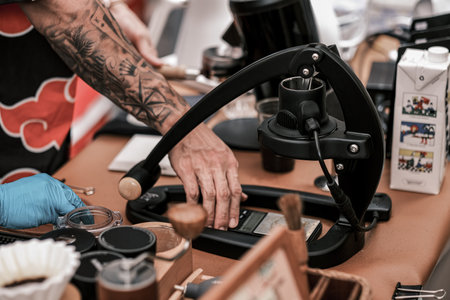 Barista preparing coffee using pour over coffee maker and drip kettle. Man making coffee....