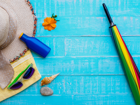 Summer concept. Summer accessories and sea shells on wooden background.の写真素材
