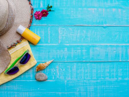 Summer concept. Summer accessories and sea shells on wooden background.の写真素材
