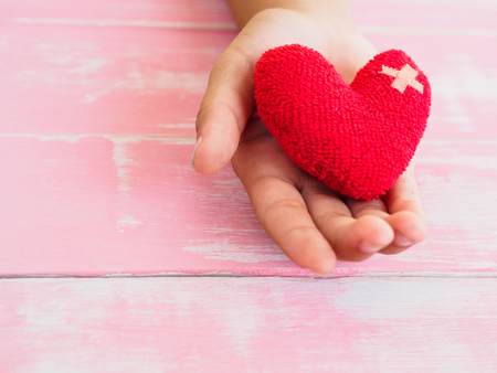 valentine, health, medicine and charity concept.  heart on aging Kid hand supportの写真素材