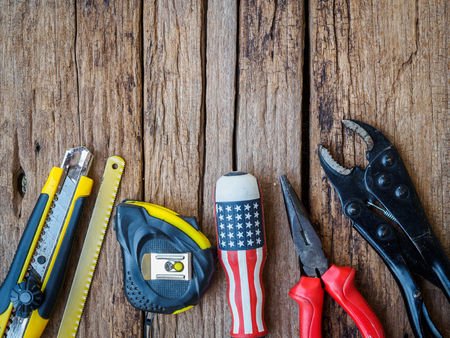Joinery tools and paper on a wooden table texture background. Labor day concept.の写真素材
