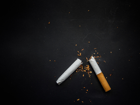 World No Tobacco Day, Broken cigarette isolated on black background. No smoking concept.の写真素材