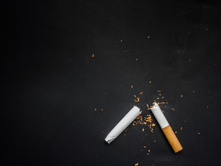 World No Tobacco Day, Broken cigarette isolated on black background. No smoking concept.の写真素材