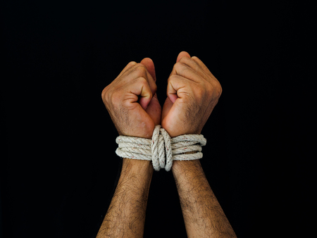 Man hands were tied with a rope. Violence, Terrified, Human Rights Day concept.の写真素材