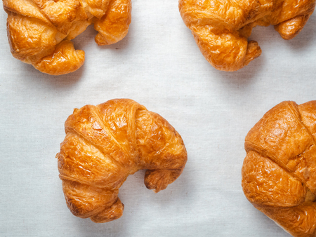 Top view of fresh croissants on white towel.の写真素材