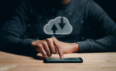 Man using smartphone with virtual cloud computing with connection line.Cloud computing system for...