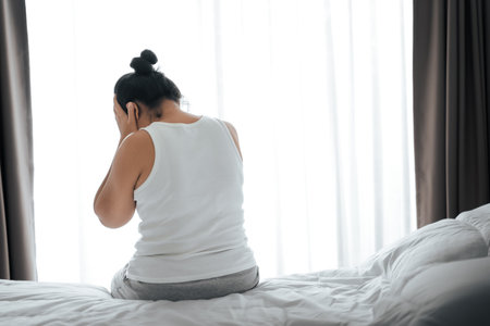 Exhausted tired depressed stressed thoughtful mature senior woman suffering from headaches, Brain diseases, mental problems, Alzheimer Concept.の写真素材