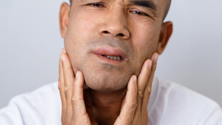 The man has facial swelling due to an allergic reaction to triggers such as insect bites stings,...