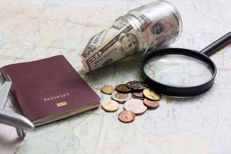 Preparation for travel, money and passport on wooden table,Top viewの写真素材