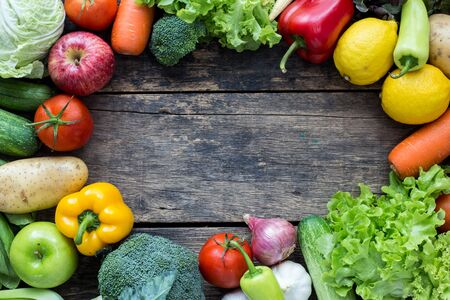 Top view of fruits and vegetables on the old wood table With copy spaceの写真素材