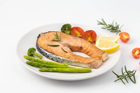 Salmon Grilled on a white plate isolated on white background.の写真素材