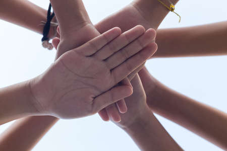 close up hand girl power , Teamwork stacking hand Conceptの写真素材