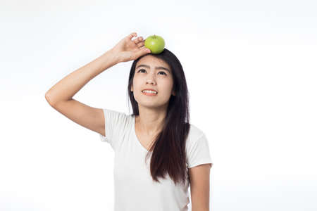 asian youn woman healthy holding green apples on white backgroundの写真素材