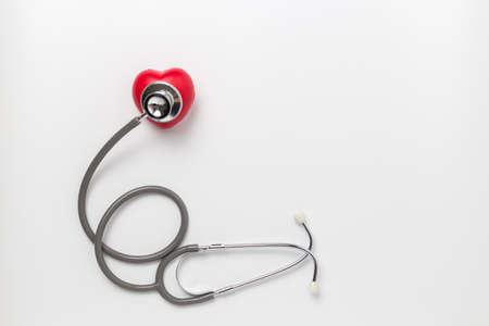 red heart and stethoscope isolated on white background , Health Care concept.の写真素材