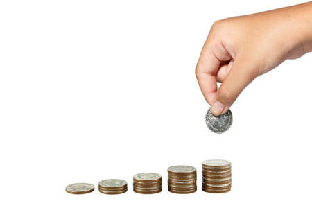 Saving money concept,girl hand putting money coin stack growing , isolated on white
