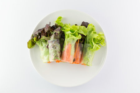 Salad rolls on a White Plate on white background.の写真素材