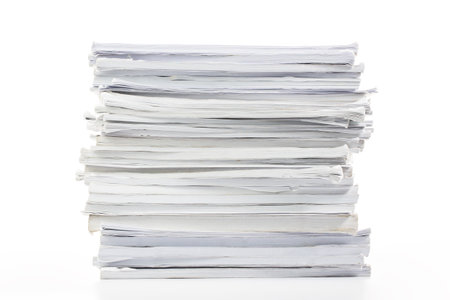 Close-up of papers stack isolated on a white background