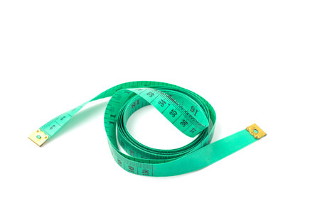 Green measuring tape isolated on white background