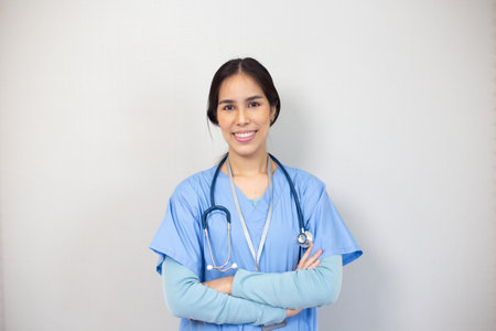 Portrait of young asian nurse in the white room, healthcare workers concept.