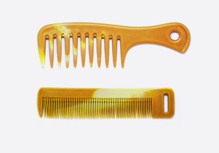 Two types of brown wood combs for hair styling or hair sets for both men and women with long hair,...