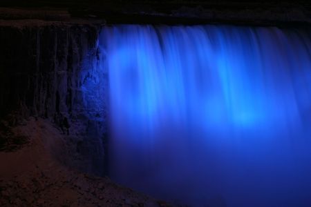Niagara Horse Shoe Falls at Night with Blue Lightsの写真素材