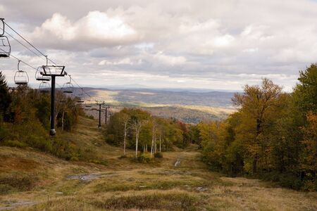 Colorful Trees During Autumn Season Next to Ski Liftの写真素材