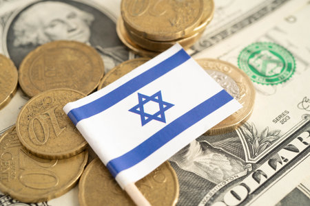 Israel flag on coin and banknote money, finance trading investment business currency.の写真素材