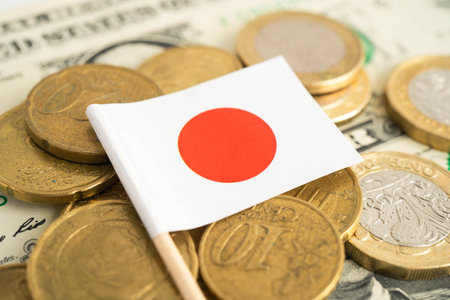 Japan flag on coin and banknote money, finance trading investment business currency.
