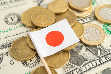 Japan flag on coin and banknote money, finance trading investment business currency.
