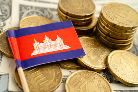 Cambodia flag on coin and banknote money, finance trading investment business currency.の写真素材