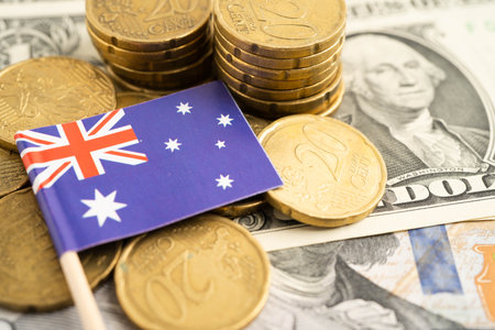 Australia flag on coin and banknote money, finance trading investment business currency.の写真素材