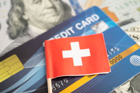 Switzerland flag on coin and banknote money, finance trading investment business currency.の写真素材