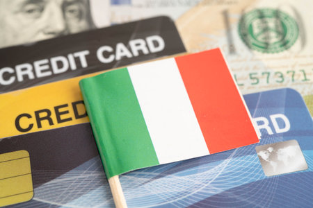 Italy flag on coin and banknote money, finance trading investment business currency.の写真素材