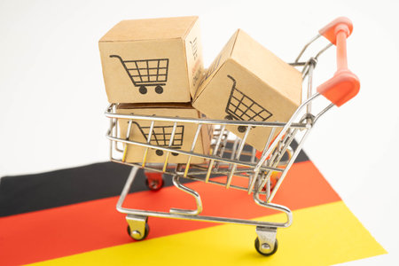 Germany flag with Shopping cart box, import export, finance commerce.の写真素材