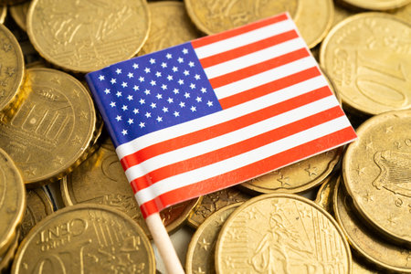 US America flag on coin and banknote money, finance trading investment business currency.の写真素材
