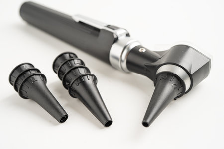 Otoscope isolated on white background for otolaryngologist or ENT physician doctor examining senior patient ear, hearing loss problem.の写真素材