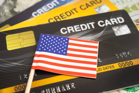 USA flag on coin and banknote money, finance trading investment business currency.の写真素材