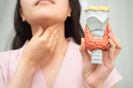 Hyperthyroidism, Overactive Thyroid, Thyroid Lymphoma, Asian woman with thyroid gland human anatomy...