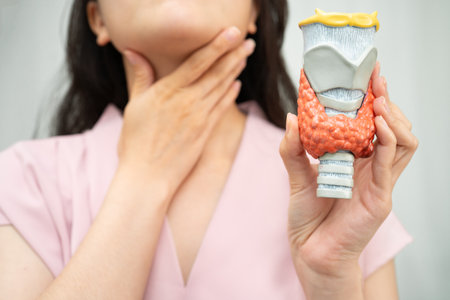 Hyperthyroidism, Overactive Thyroid, Thyroid Lymphoma, Asian woman with thyroid gland human anatomy model.の写真素材