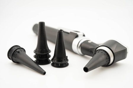 Otoscope isolated on white background for otolaryngologist or ENT physician doctor examining senior patient ear, hearing loss problem.の写真素材