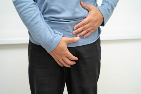 Hernia, Asian man stomach ache, abdominal pain and urology problem health.