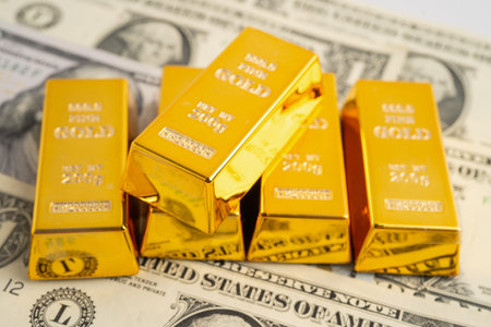 Gold bars with US dollar and Euro banknote money, finance trading investment business currency.
