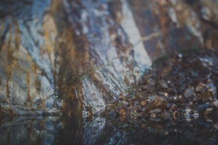 Steep rock of Tuimsky failure - a huge hole in the mountainの写真素材