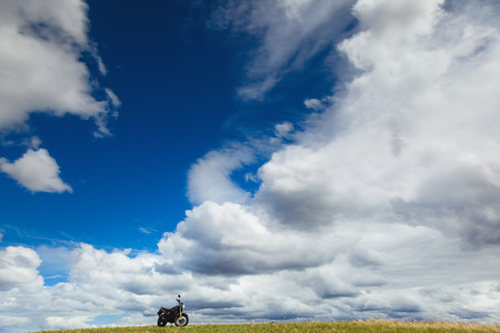 motorcycle on a field on a sunny dayの写真素材